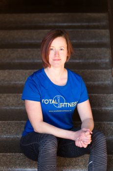 Amanda Cole Total Balance Fitness headshot stairs.jpg